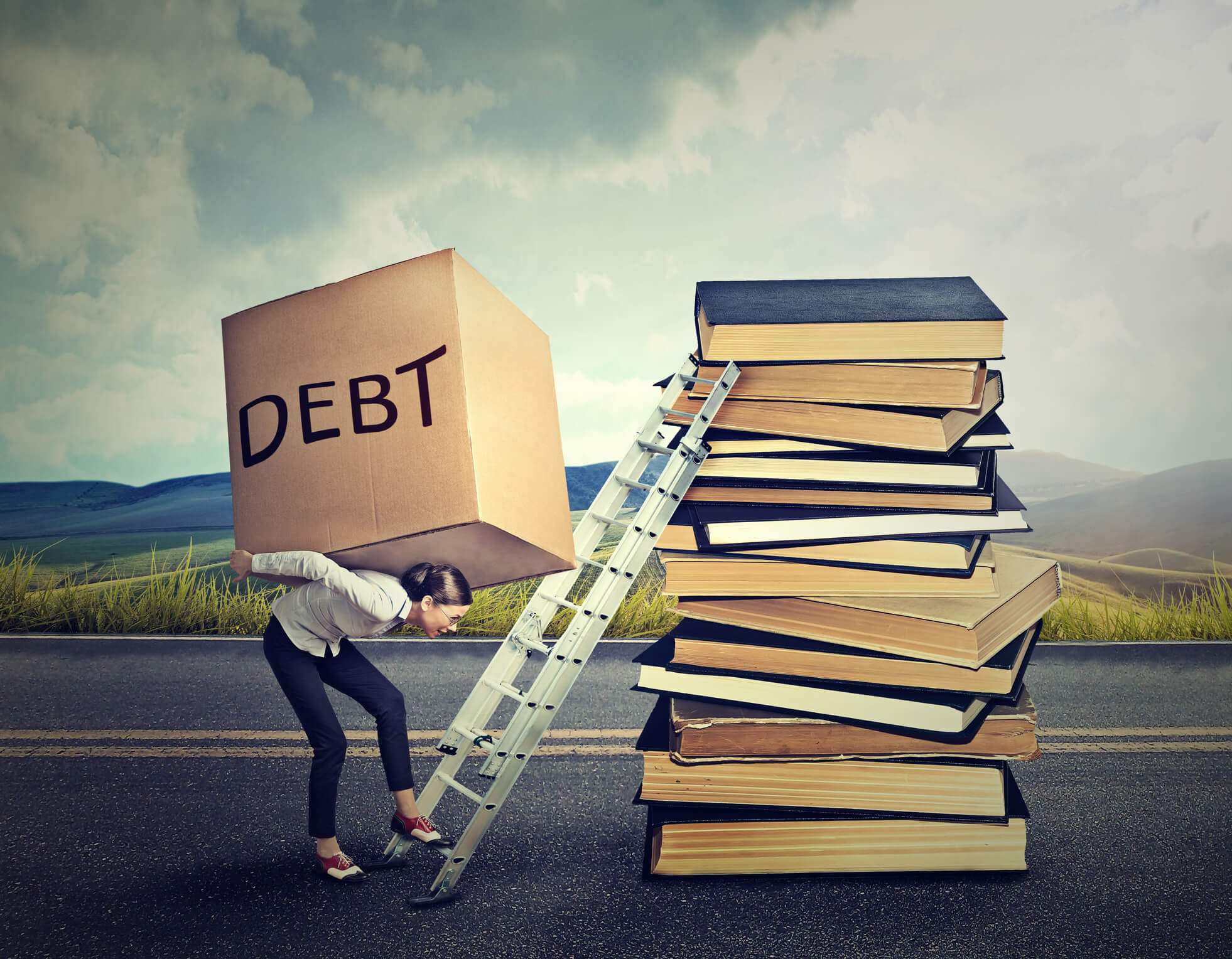 a woman carrying a box with "debt" on the side trying to climb a ladder leaning over a pile of books